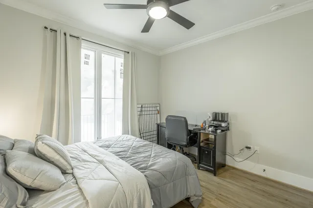 a view of a hallway with a table and a chair