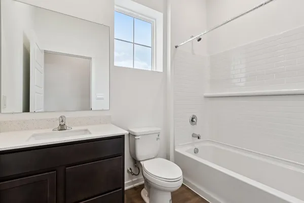 an empty room with an entrance to other room
