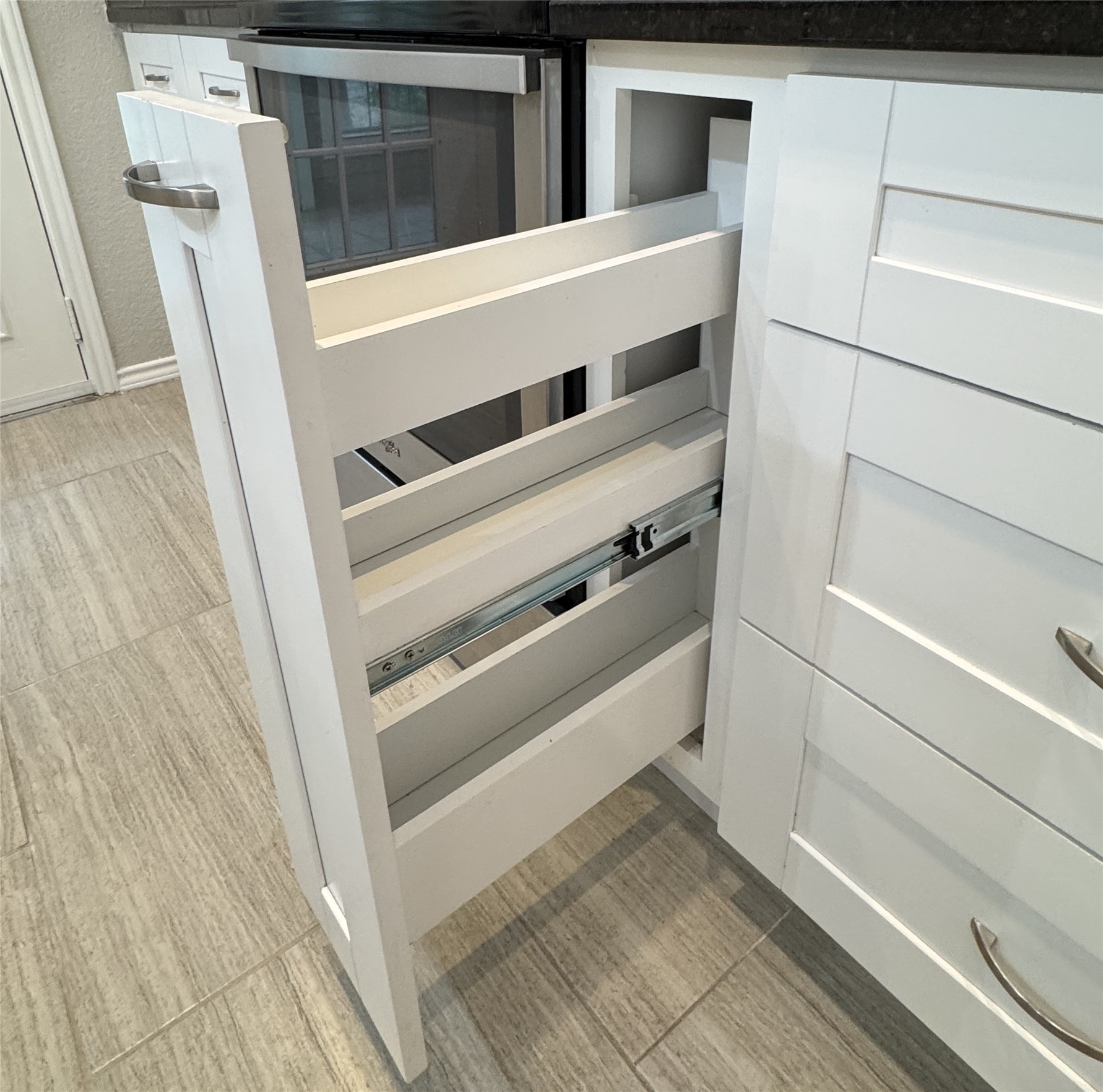 3809 Spicewood Springs Road, Unit 137 Austin, TX 78759 - Photo 25 of 34 Love this spice pull-out next to the stove!