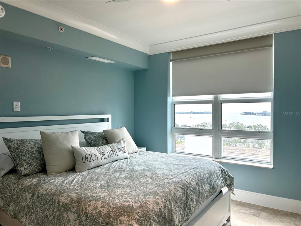 1350 Main Street, Unit 1210 Sarasota, FL 34236 - Photo 19 of 53 a bed sitting in a bedroom next to a window