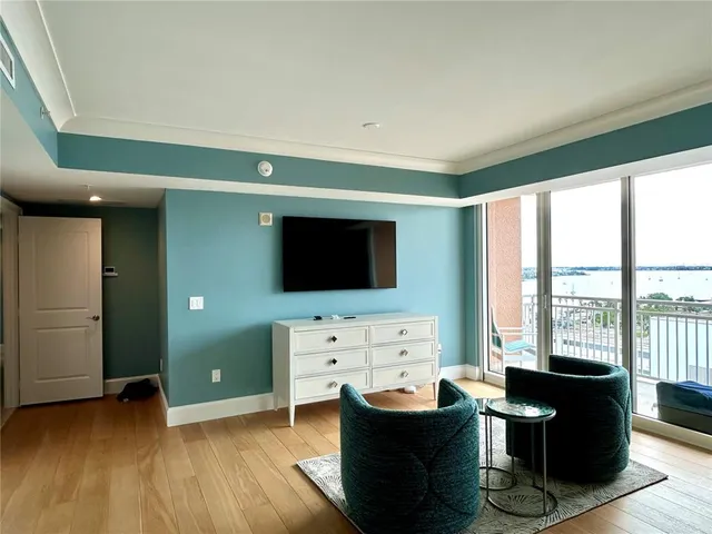 a spacious bedroom with a large bed and a couch