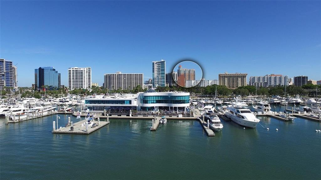 1350 Main Street, Unit 1210 Sarasota, FL 34236 - Photo 3 of 53 a view of a lake with a city