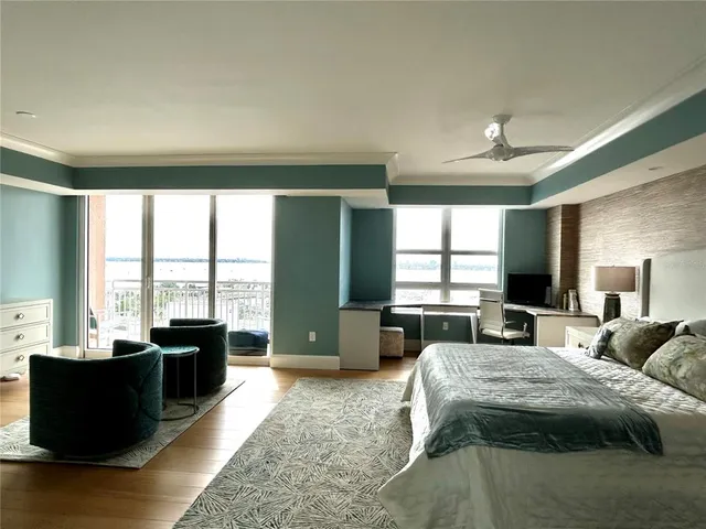 a large tub sitting in a hall with a large window