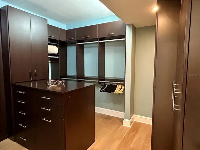 a lobby with furniture and a chandelier