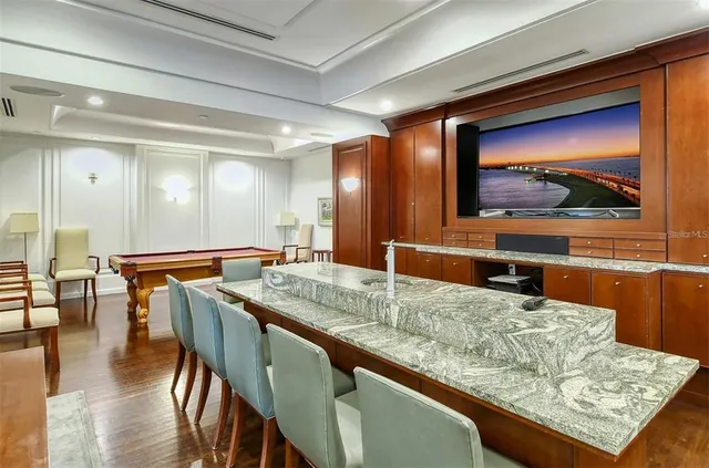 a living room with furniture a dining table and chairs