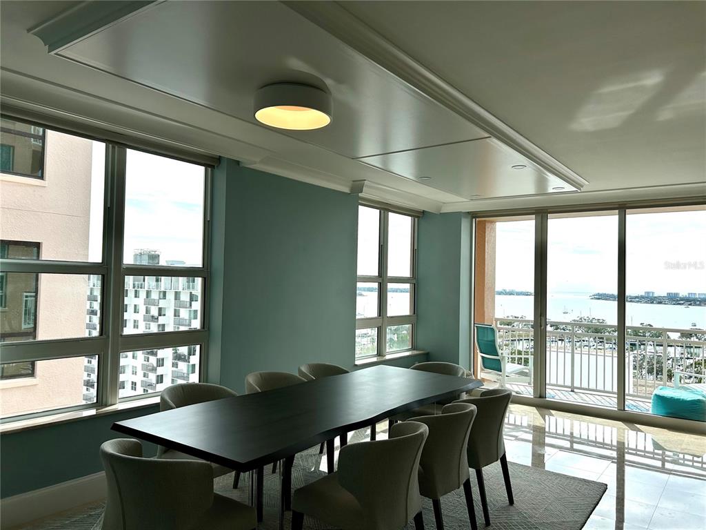 1350 Main Street, Unit 1210 Sarasota, FL 34236 - Photo 5 of 53 a view of a dining room with furniture and a window