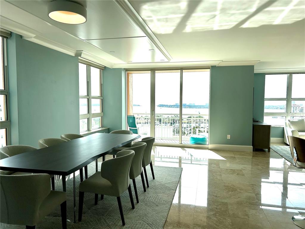 1350 Main Street, Unit 1210 Sarasota, FL 34236 - Photo 6 of 53 a living room with furniture and a floor to ceiling window