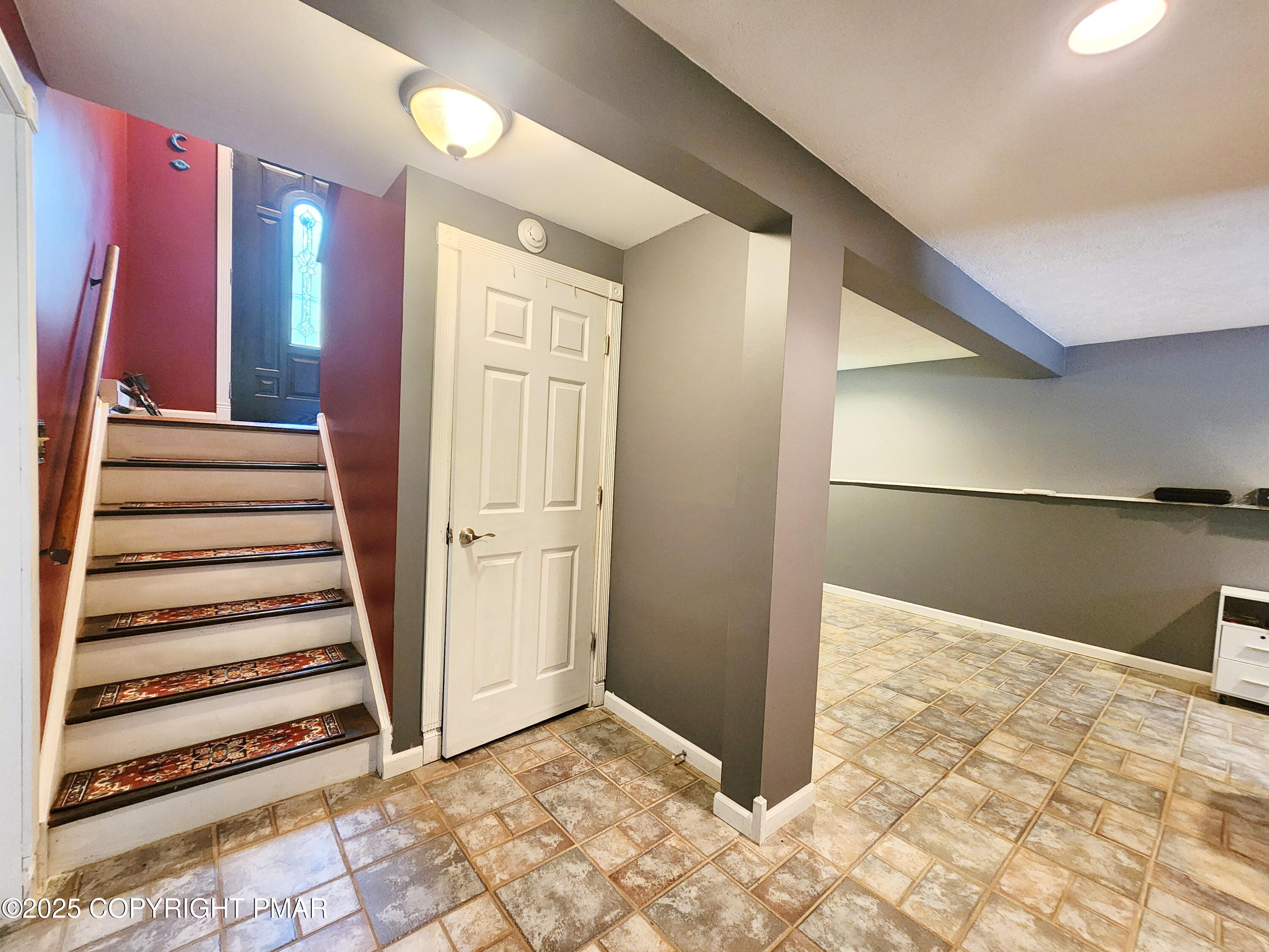 1152 Steele Circle Bushkill, PA 18324 - Photo 11 of 15 a view of a hallway with entryway and stairs