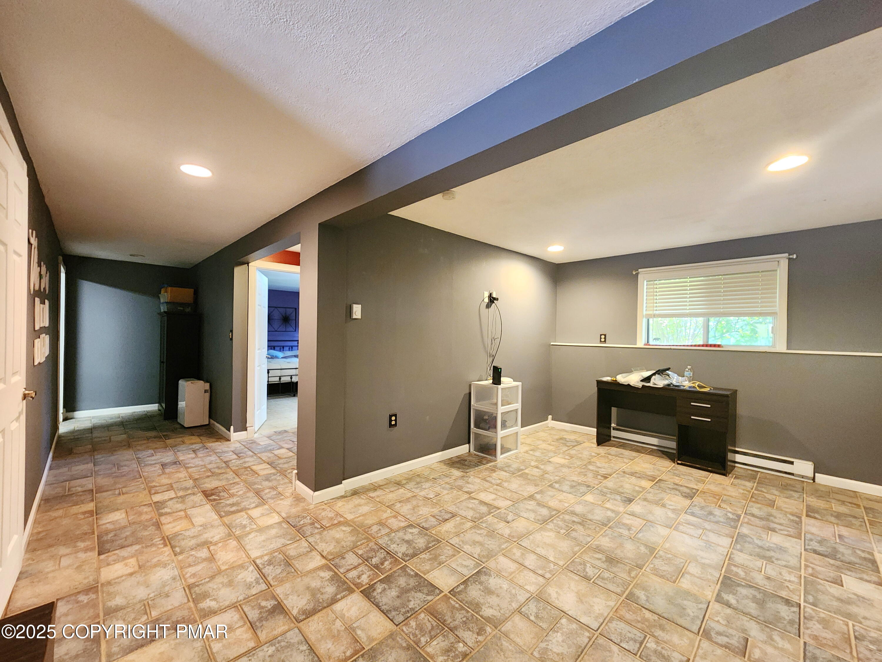 1152 Steele Circle Bushkill, PA 18324 - Photo 13 of 15 a bedroom with a bed and a view of living room