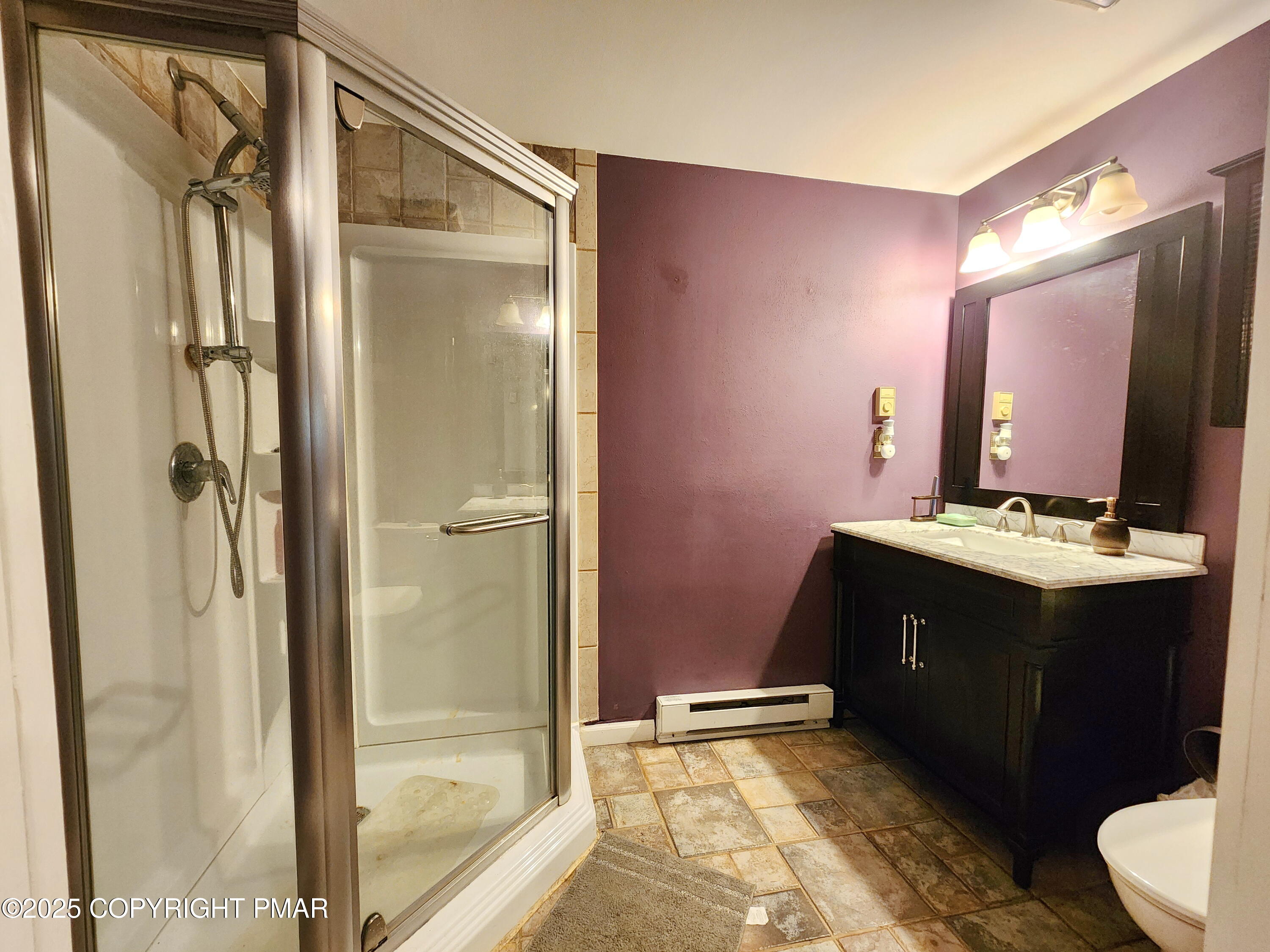 1152 Steele Circle Bushkill, PA 18324 - Photo 15 of 15 a bathroom with a double vanity sink mirror and shower