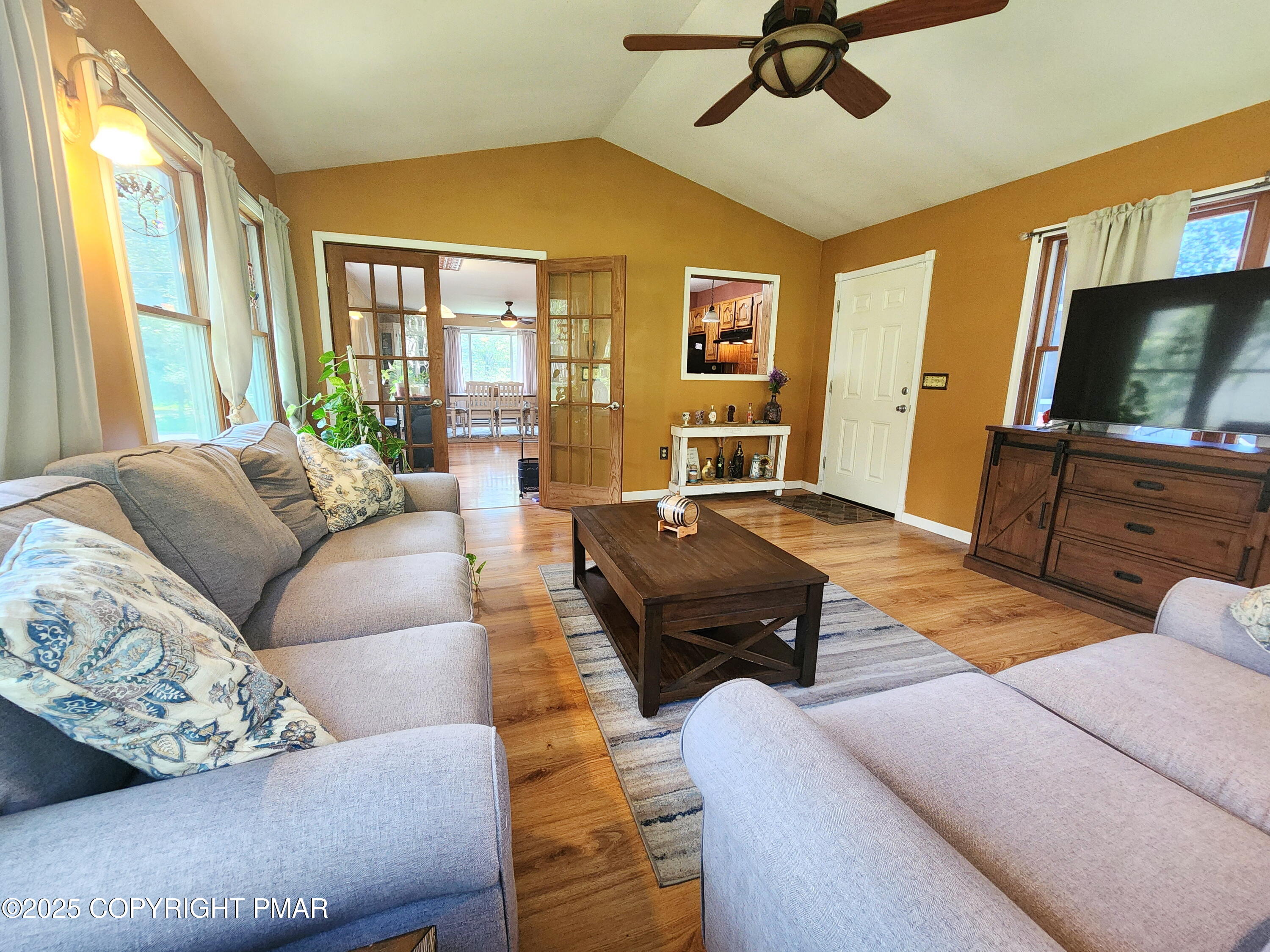 1152 Steele Circle Bushkill, PA 18324 - Photo 4 of 15 a living room with furniture flat screen tv and a large window
