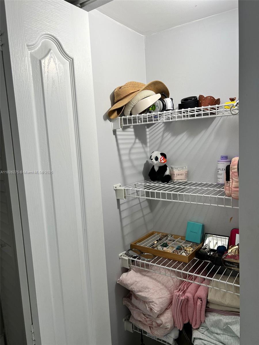 12922 Southwest 88th Terrace, Unit B206 Miami, FL 33186 - Photo 12 of 16 a table and chairs in a kitchen