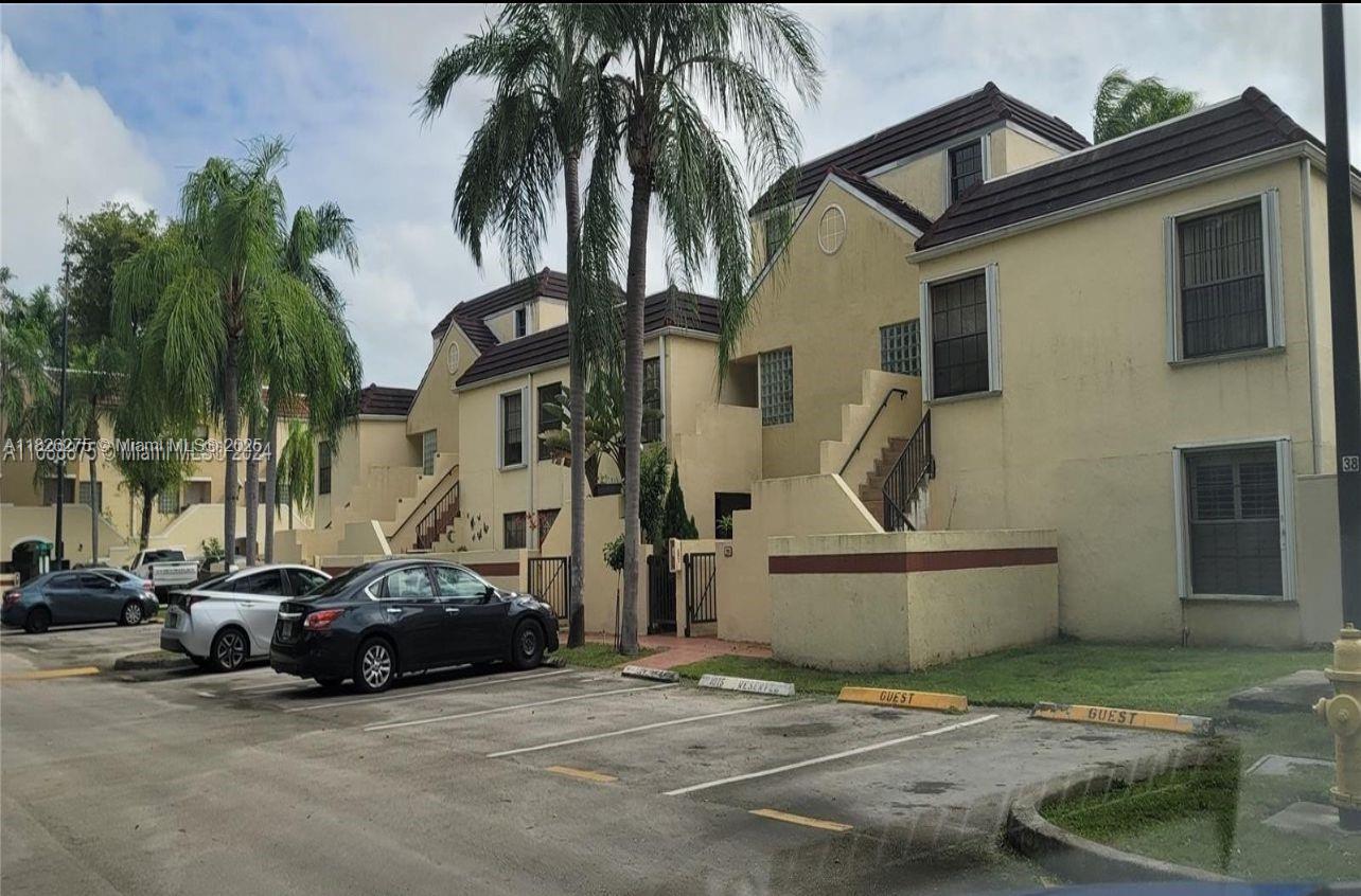12922 Southwest 88th Terrace, Unit B206 Miami, FL 33186 - Photo 15 of 16 a view of a street with cars
