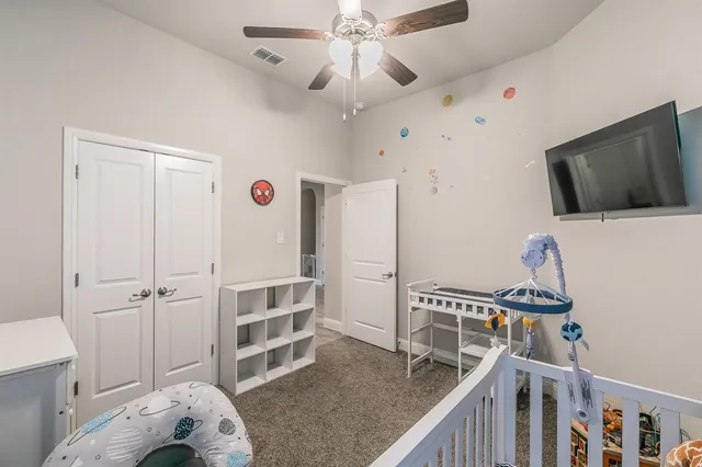 a view of a livingroom with furniture and staircase