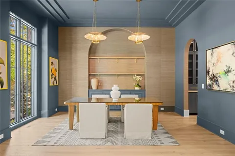 a kitchen with a stove and white cabinets