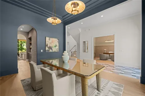 a view of a livingroom with balcony and fireplace