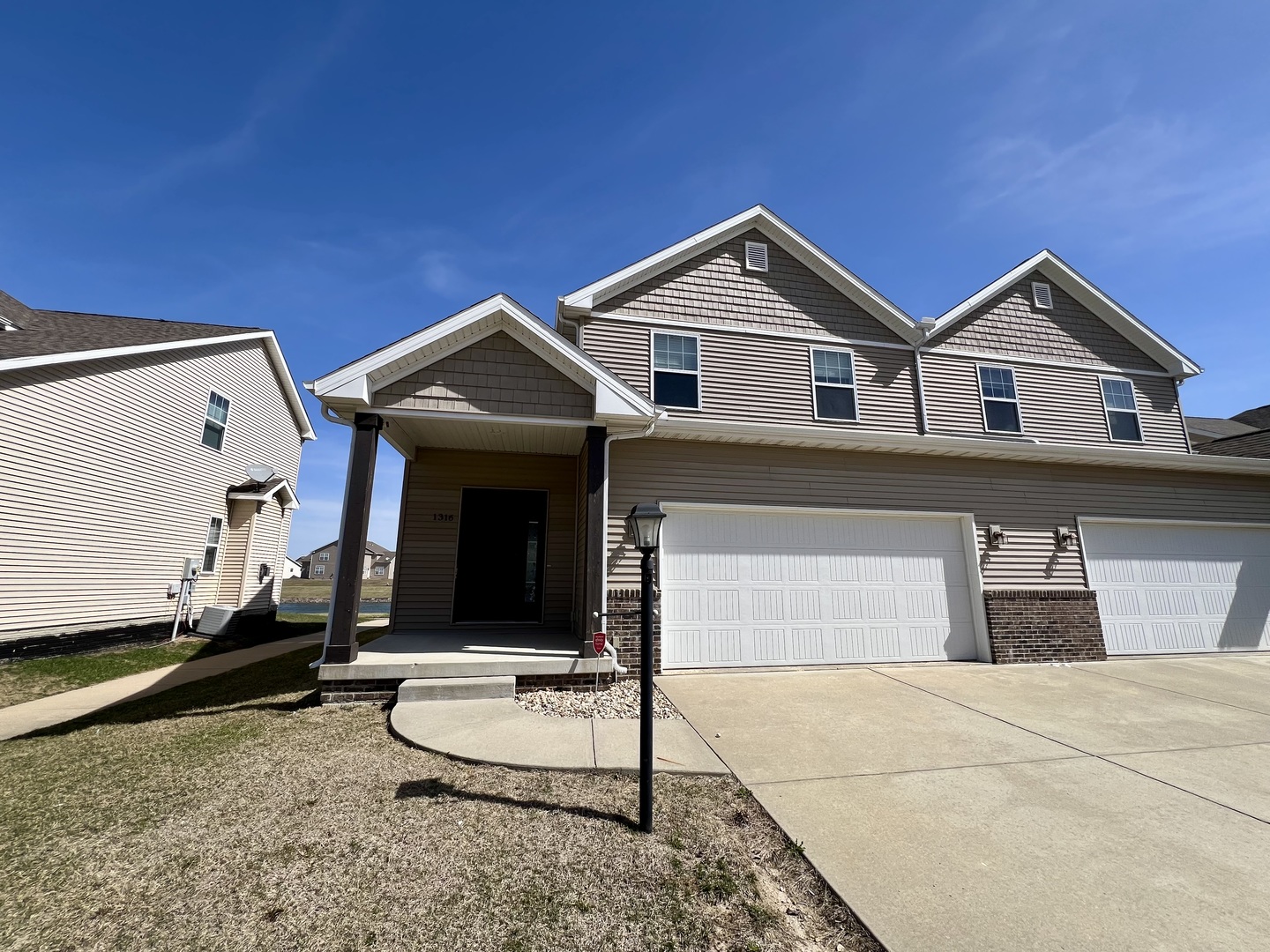 1320 Myrtle Beach Avenue Champaign, IL 61822 - Photo 1 of 29 a front view of a house with a garage