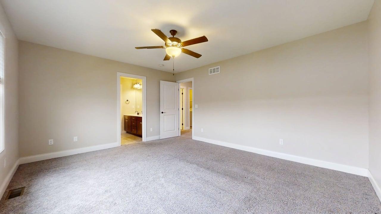 1320 Myrtle Beach Avenue Champaign, IL 61822 - Photo 14 of 29 a view of an empty room with a ceiling fan