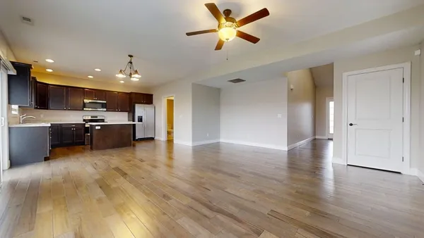 a view of a kitchen with a sink and a stove top oven