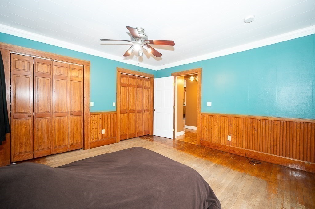 134 Baker Street Gardner, MA 01440 - Photo 11 of 42 a view of a livingroom with a chandelier fan and windows
