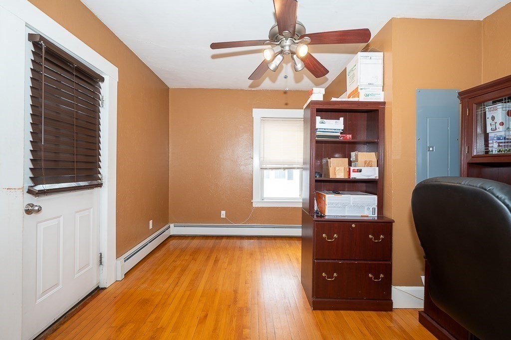 134 Baker Street Gardner, MA 01440 - Photo 14 of 42 a view of a workspace with furniture and wooden floor