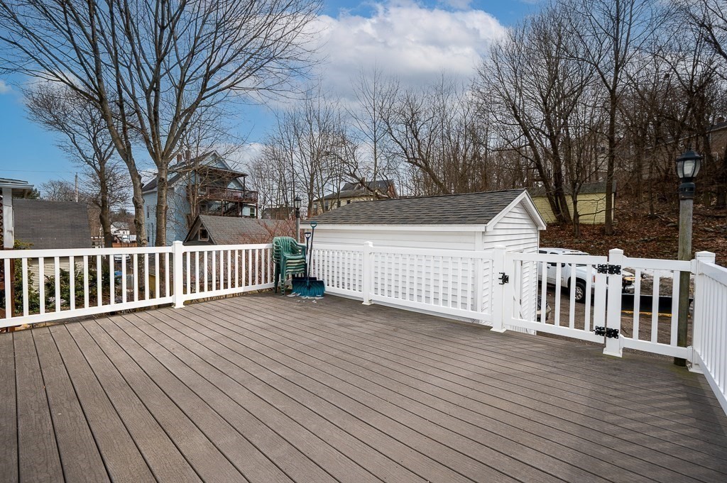 134 Baker Street Gardner, MA 01440 - Photo 16 of 42 a view of a wooden deck