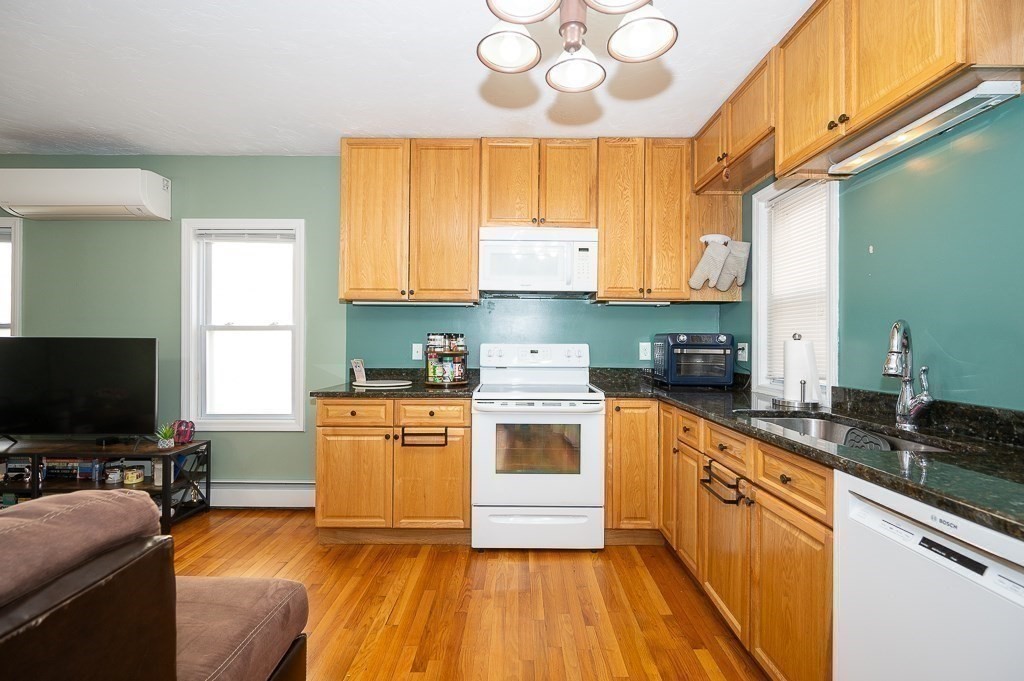 134 Baker Street Gardner, MA 01440 - Photo 25 of 42 a kitchen with stainless steel appliances granite countertop a stove and a sink