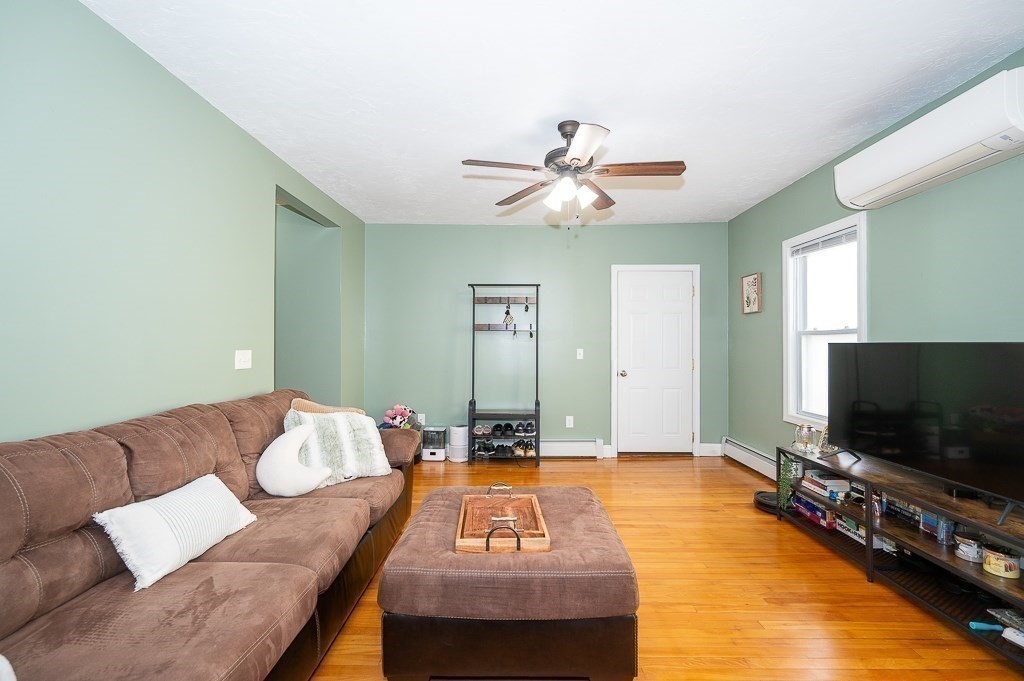 134 Baker Street Gardner, MA 01440 - Photo 29 of 42 a living room with furniture and a flat screen tv