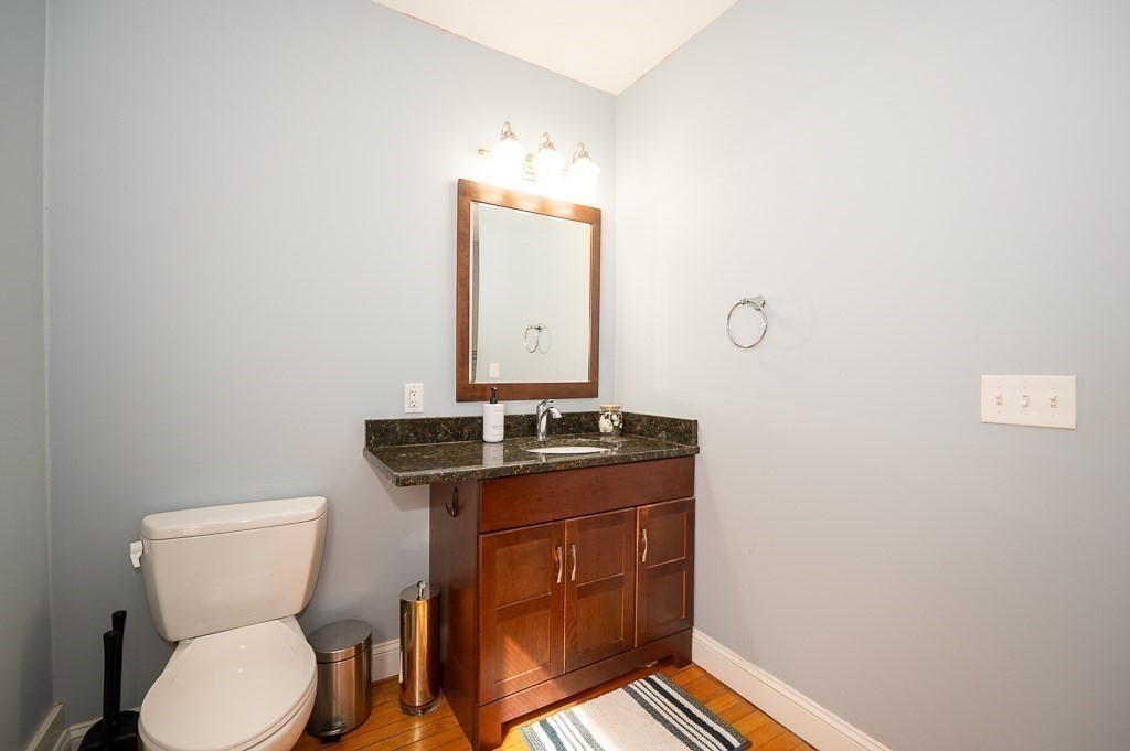 134 Baker Street Gardner, MA 01440 - Photo 33 of 42 a bathroom with a toilet sink and mirror