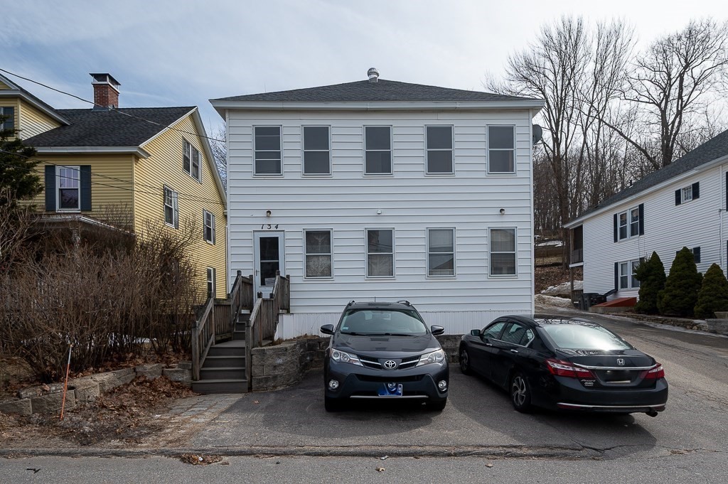 134 Baker Street Gardner, MA 01440 - Photo 38 of 42 a car parked in front of a house
