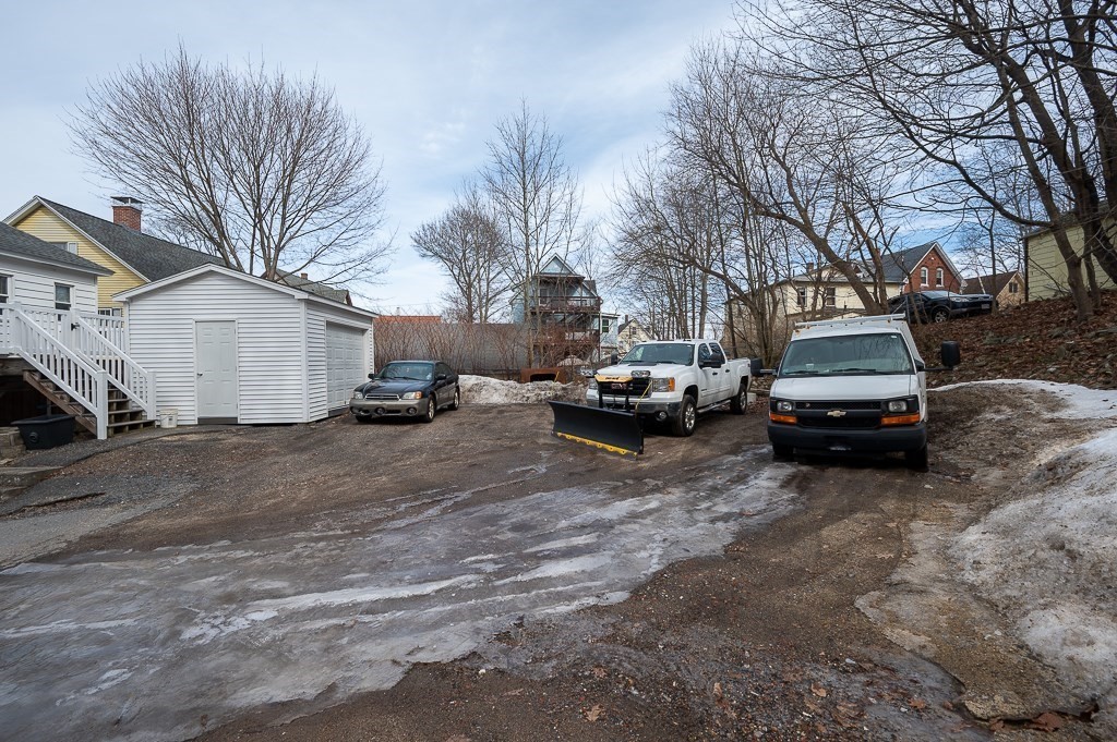 134 Baker Street Gardner, MA 01440 - Photo 40 of 42 a view of a cars parked in front of a house
