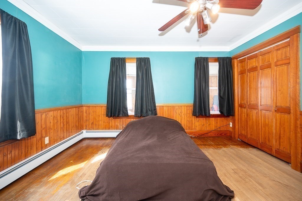 134 Baker Street Gardner, MA 01440 - Photo 10 of 42 a bedroom with window and walk in closet