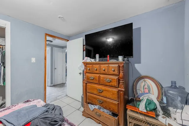 a room with furniture and flat screen tv