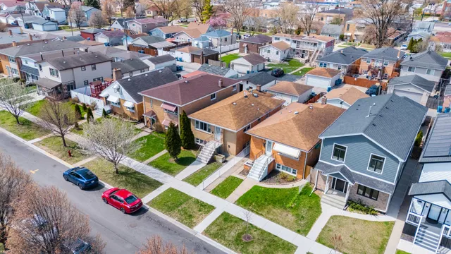 an aerial view of residential houses with outdoor space