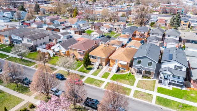 an aerial view of residential building and parking space
