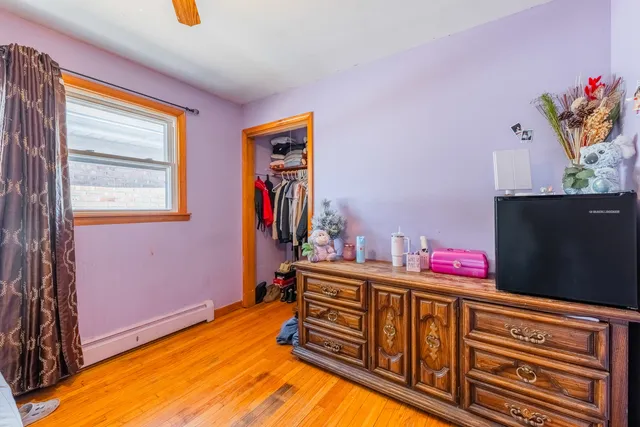 a bedroom with furniture and a window