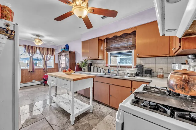 a kitchen with a stove and a sink
