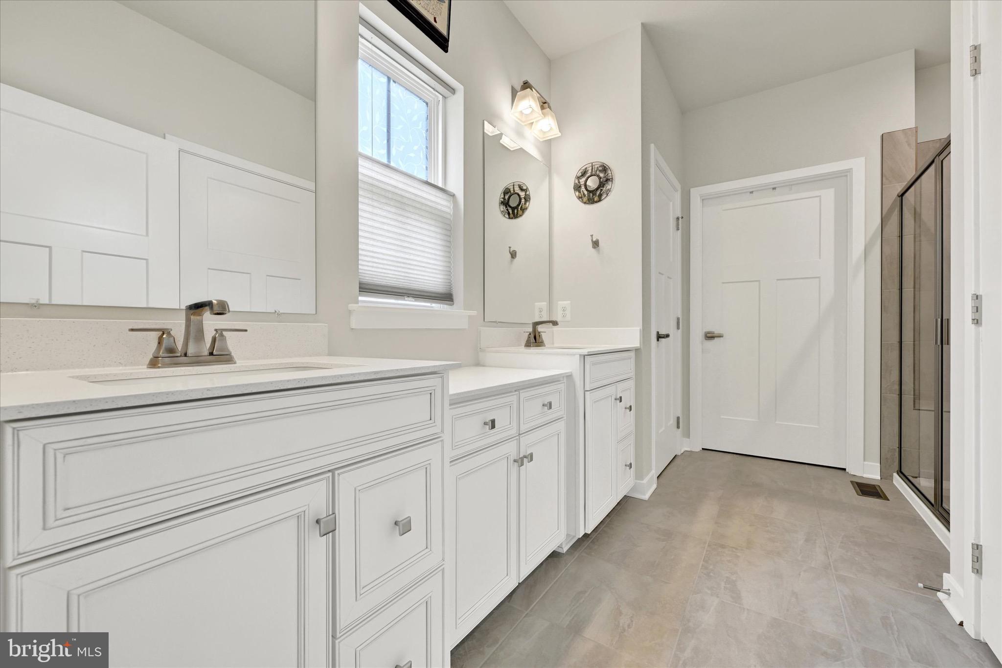 933 Swilken Bridge Road Aberdeen, MD 21001 - Photo 18 of 37 a spacious bathroom with double sink and a mirror