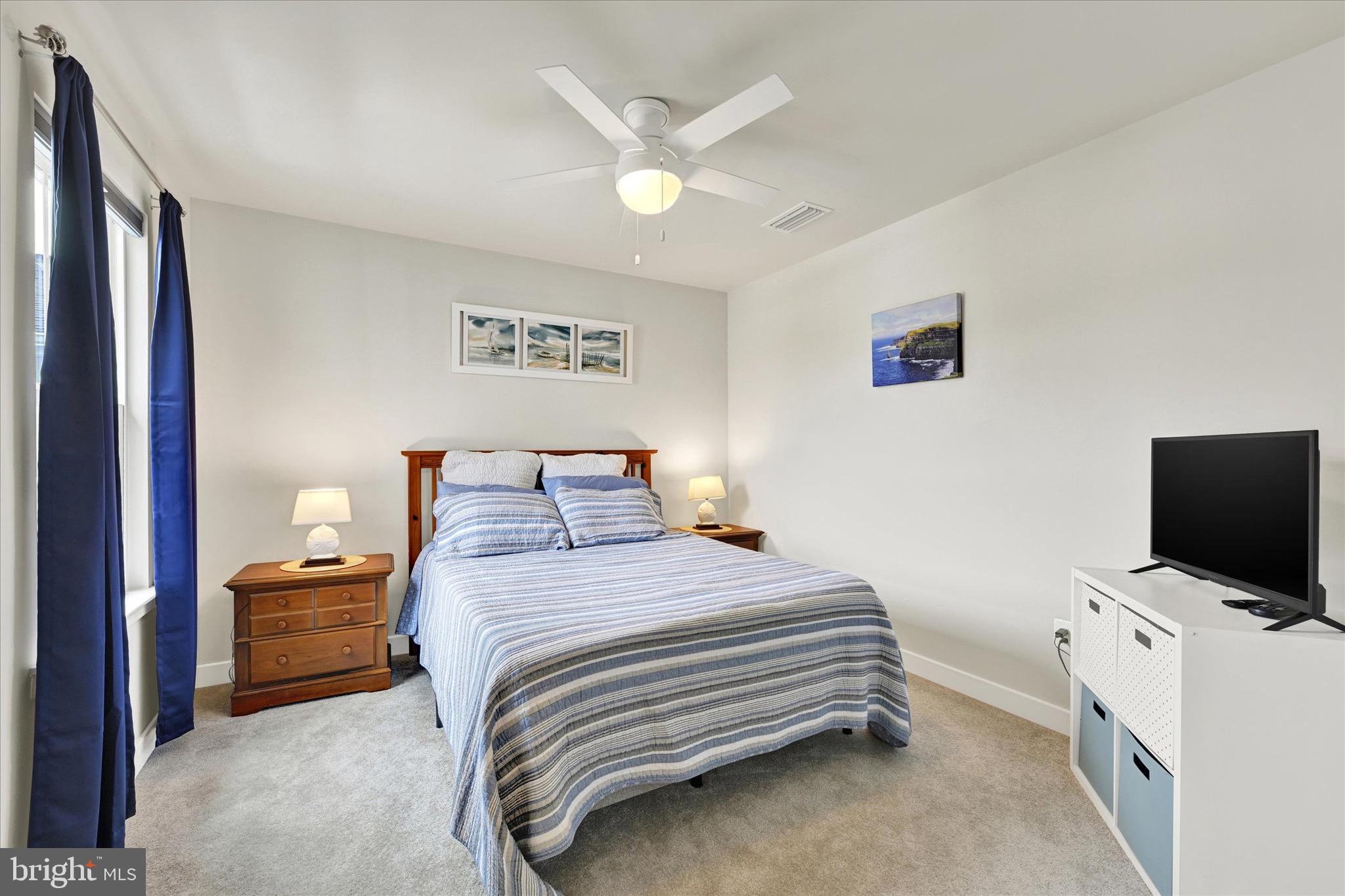 933 Swilken Bridge Road Aberdeen, MD 21001 - Photo 23 of 37 a bedroom with a bed and a flat screen tv