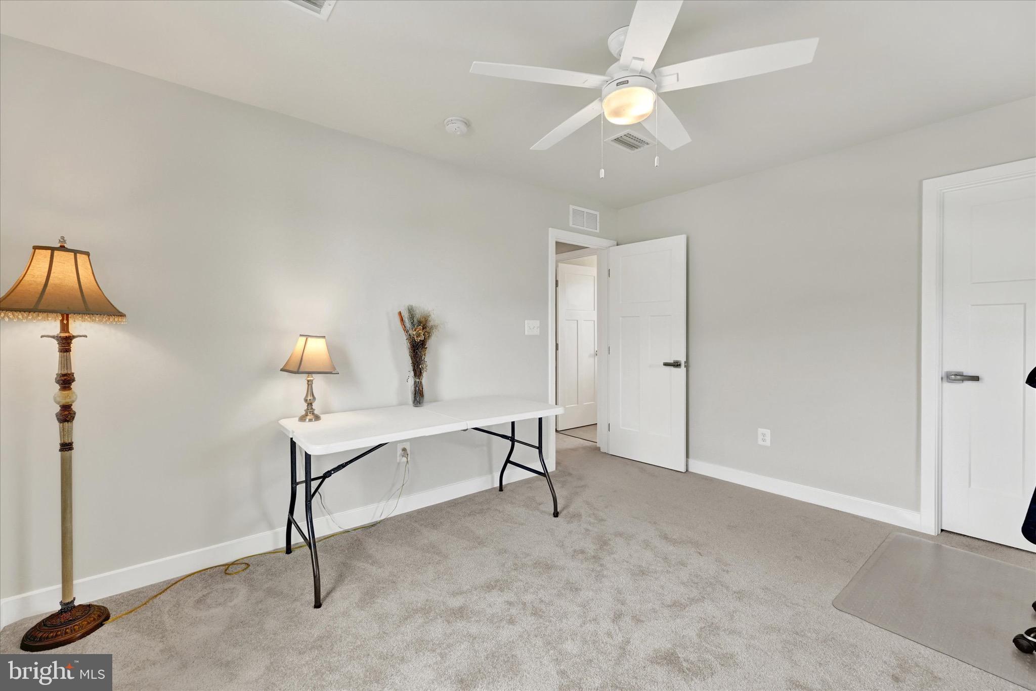 933 Swilken Bridge Road Aberdeen, MD 21001 - Photo 26 of 37 a view of a room with a table and a ceiling fan