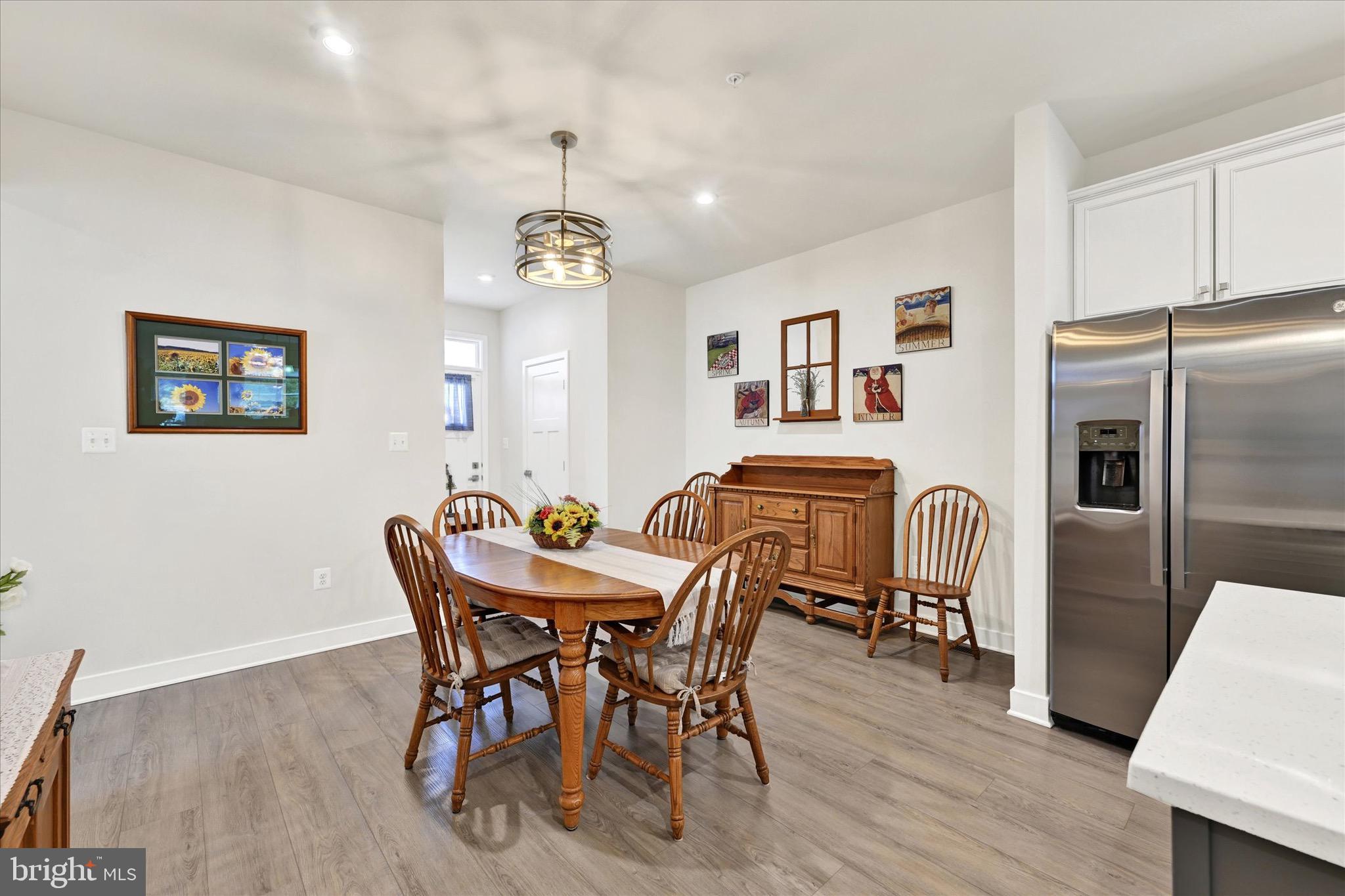 933 Swilken Bridge Road Aberdeen, MD 21001 - Photo 6 of 37 a view of a dining room with furniture wooden floor and chandelier