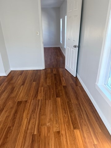 2 West 10th Street, Unit 2 Lowell, MA 01850 - Photo 12 of 13 wooden floor in front of a room