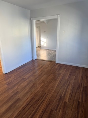2 West 10th Street, Unit 2 Lowell, MA 01850 - Photo 7 of 13 a view of empty room with wooden floor
