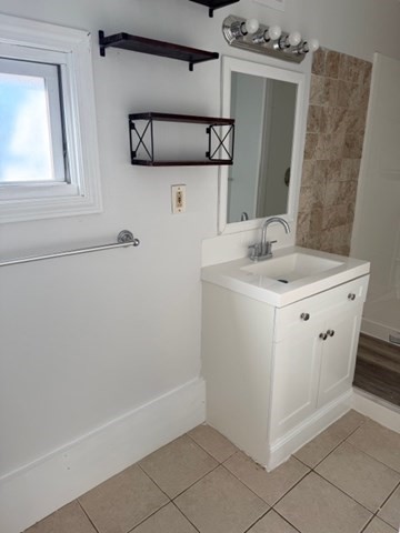 2 West 10th Street, Unit 2 Lowell, MA 01850 - Photo 8 of 13 a utility room with a sink dryer and washer