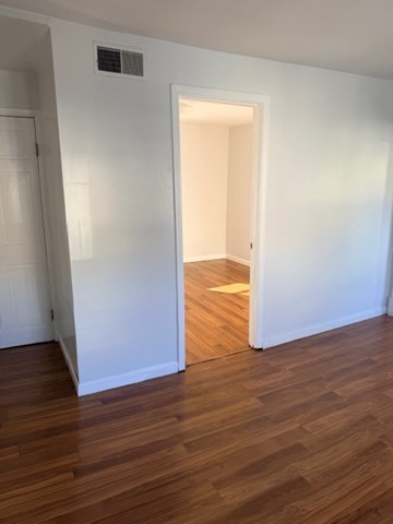 2 West 10th Street, Unit 2 Lowell, MA 01850 - Photo 9 of 13 a view of empty room with wooden floor