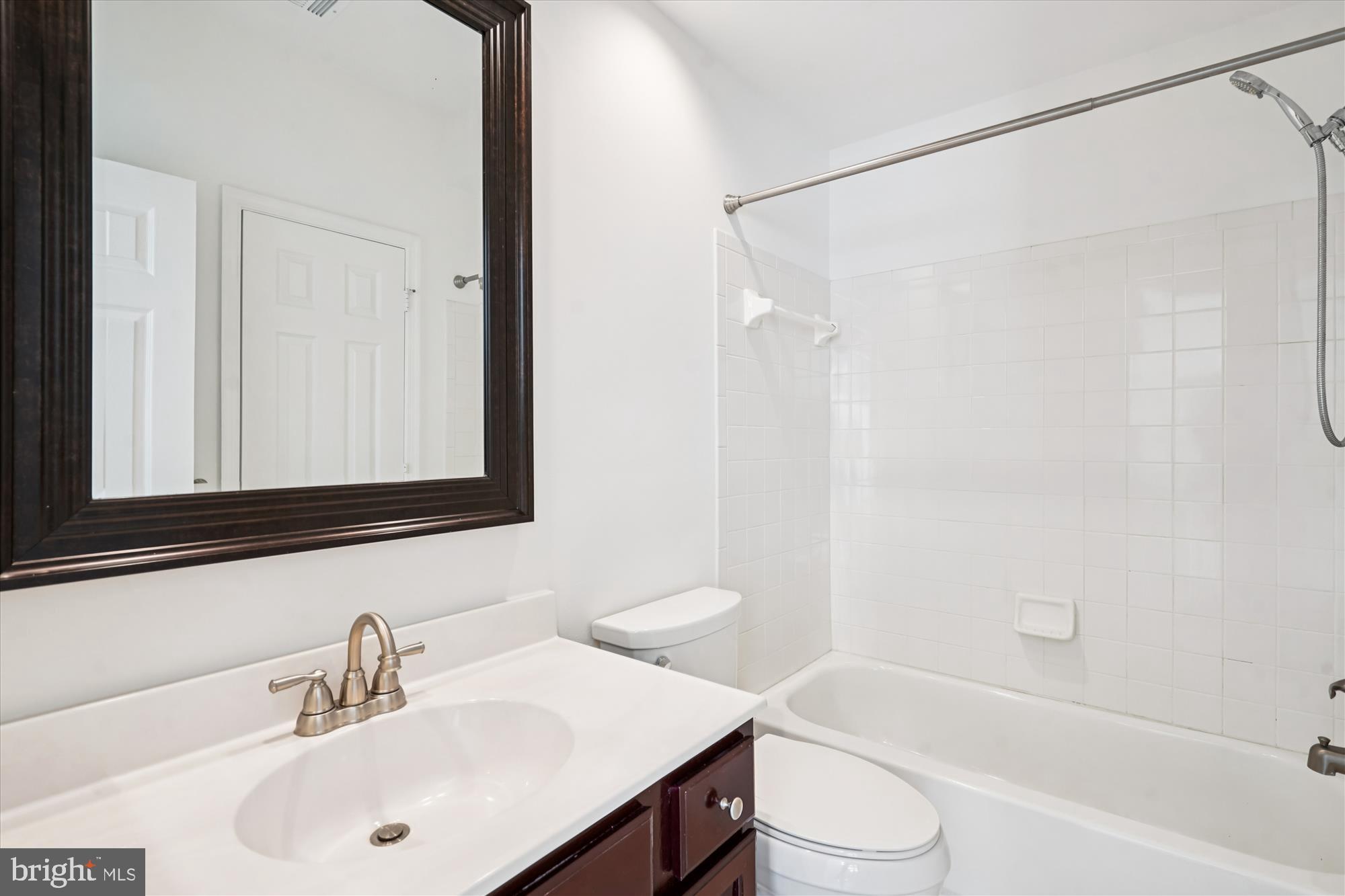 1314 Garden Wall Circle, Unit C Reston, VA 20194 - Photo 20 of 26 a bathroom with a sink toilet and shower