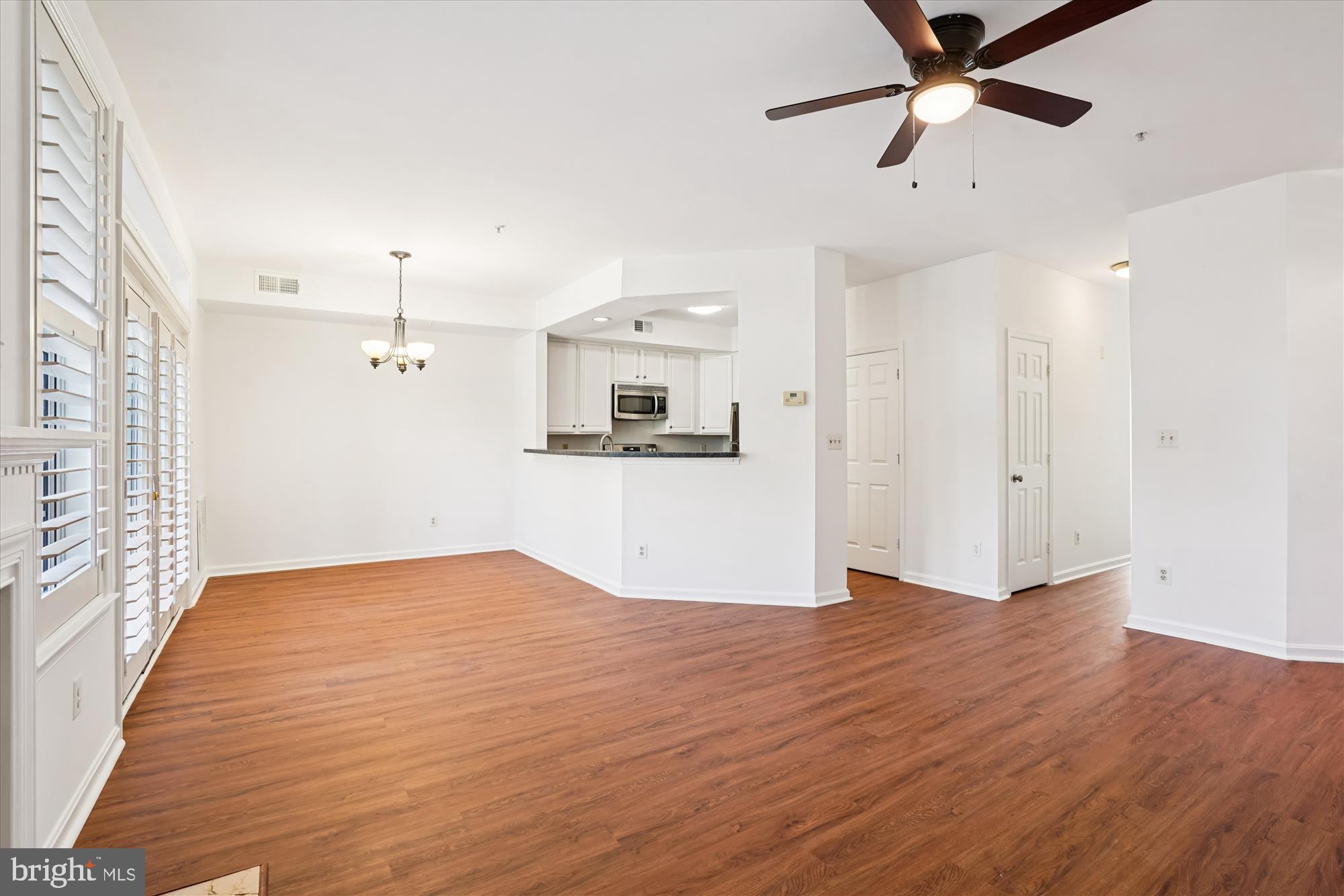 1314 Garden Wall Circle, Unit C Reston, VA 20194 - Photo 4 of 26 wooden floor in an empty room with a window