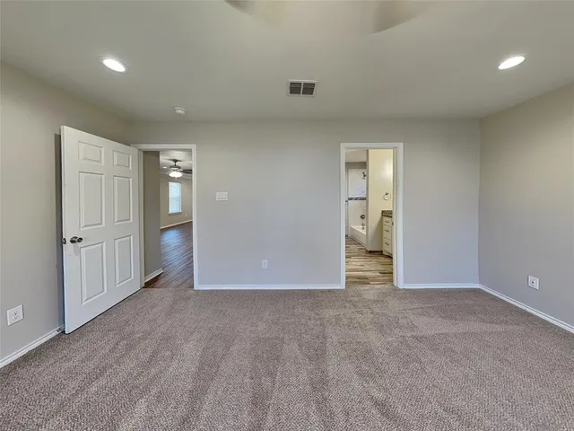 an empty room with closet area