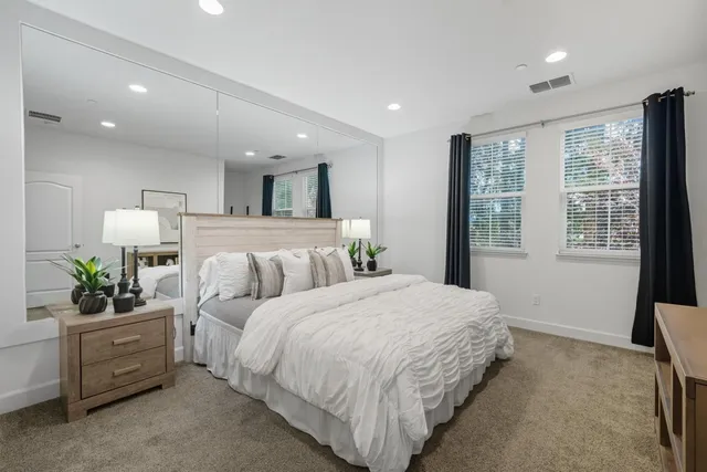 a bathroom with a sink double vanity and a mirror