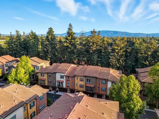 a view of a chairs and table in a backyard